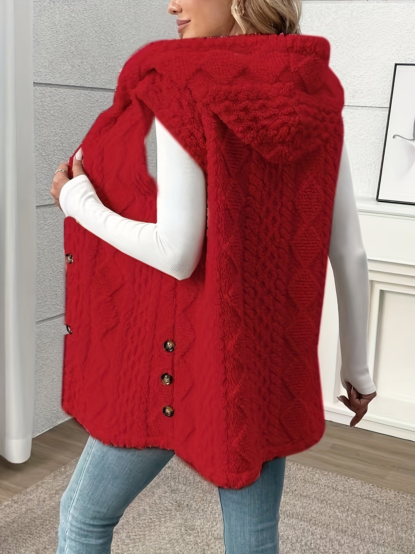 Sleek sleeveless hooded vest for women in solid color with plush texture and button detail. Machine washable and perfect for fall & winter.