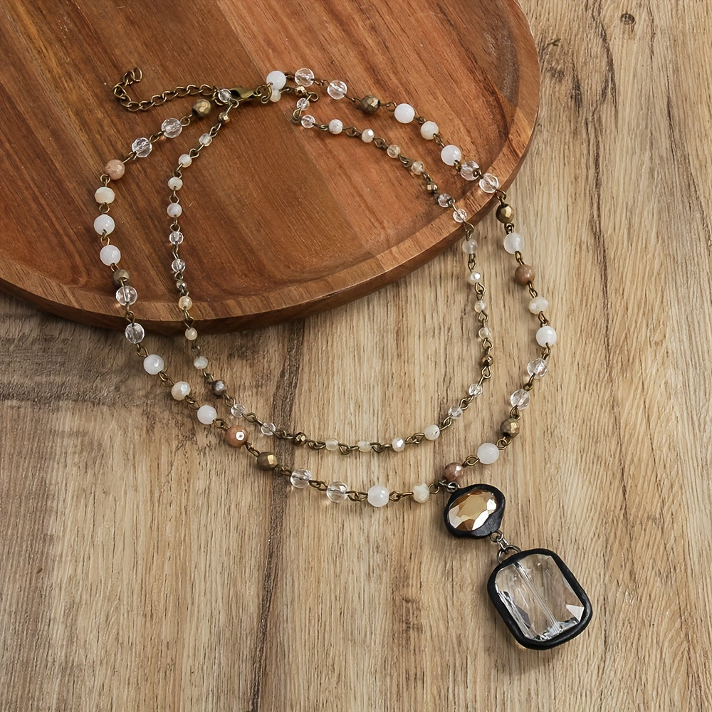 New tribal style necklace featuring two layers of natural stone crystals and glass chains, with a square glass pendant designed for daily wear by both men and women during the spring and summer seasons.