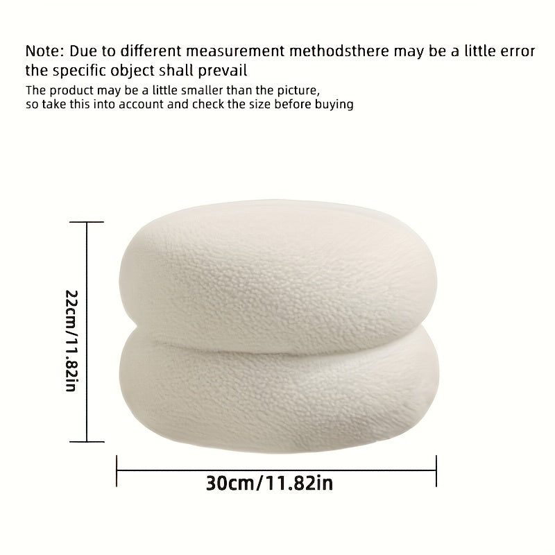 White polyester sofa stool that is versatile and compact. This round ottoman is ideal for the living room, great for changing shoes and enhancing home decor. Features a contemporary style.