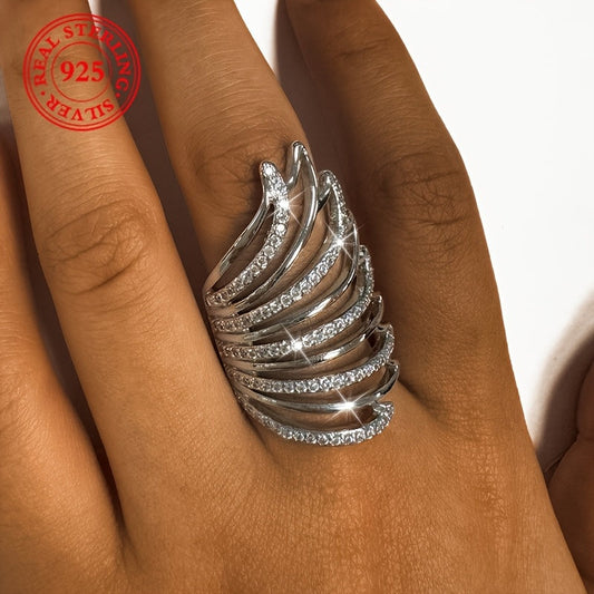 This elegant ring for women exudes a touch of luxury, featuring intricate angel wings with sparkling synthetic zirconia. Made of lightweight silver weighing 6 grams, this open ring is perfect for daily wear, special occasions, and weddings.