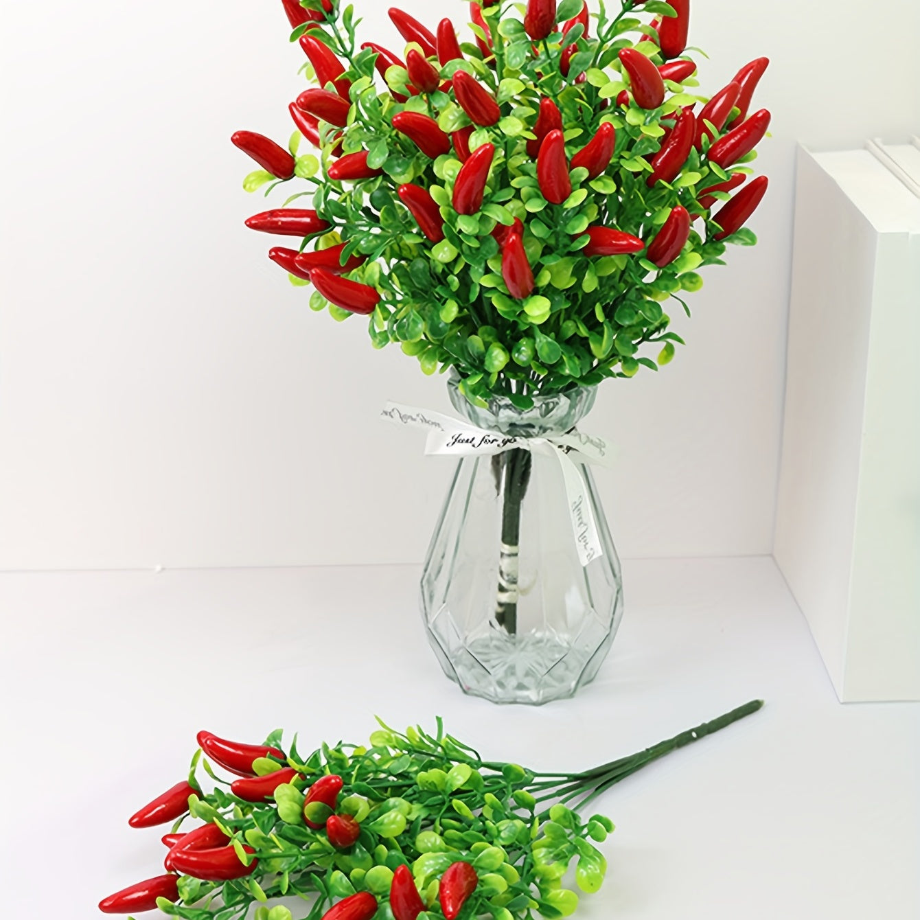 Artificial pepper chili flower bouquet for indoor or outdoor decor.