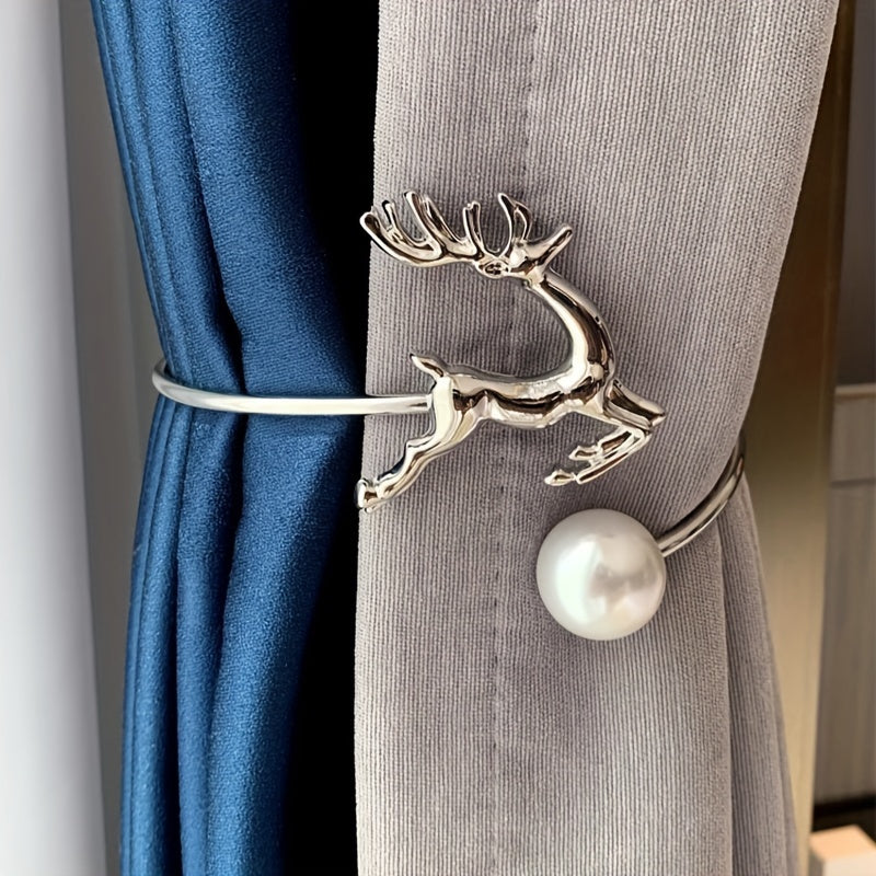 The golden coiled curtain tieback showcases a delicate deer and pearl motif.