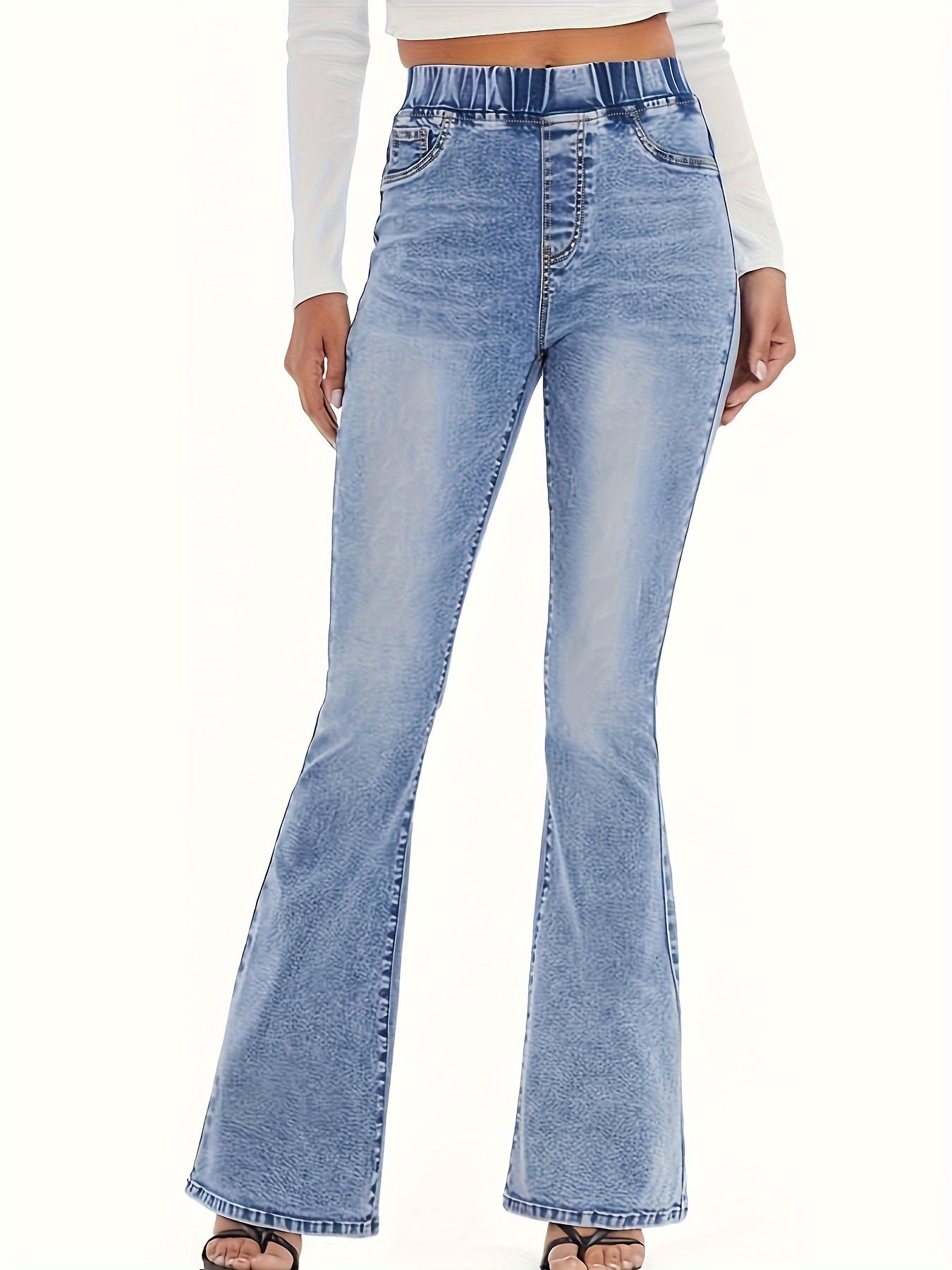 Women's high-waisted flare jeans in light wash blue, made of 65% cotton and 35% polyester blend. Features an elastic waistband, slant pockets, and smooth fabric. Suitable for casual or