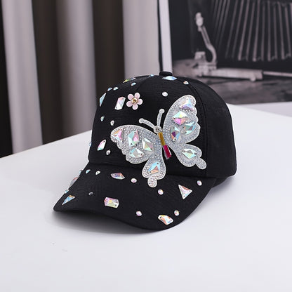 Lightweight cotton baseball cap with butterfly embellishments, rhinestone accents, adjustable fit, and woven craftsmanship. Fashionable sun protection hat for special occasions.