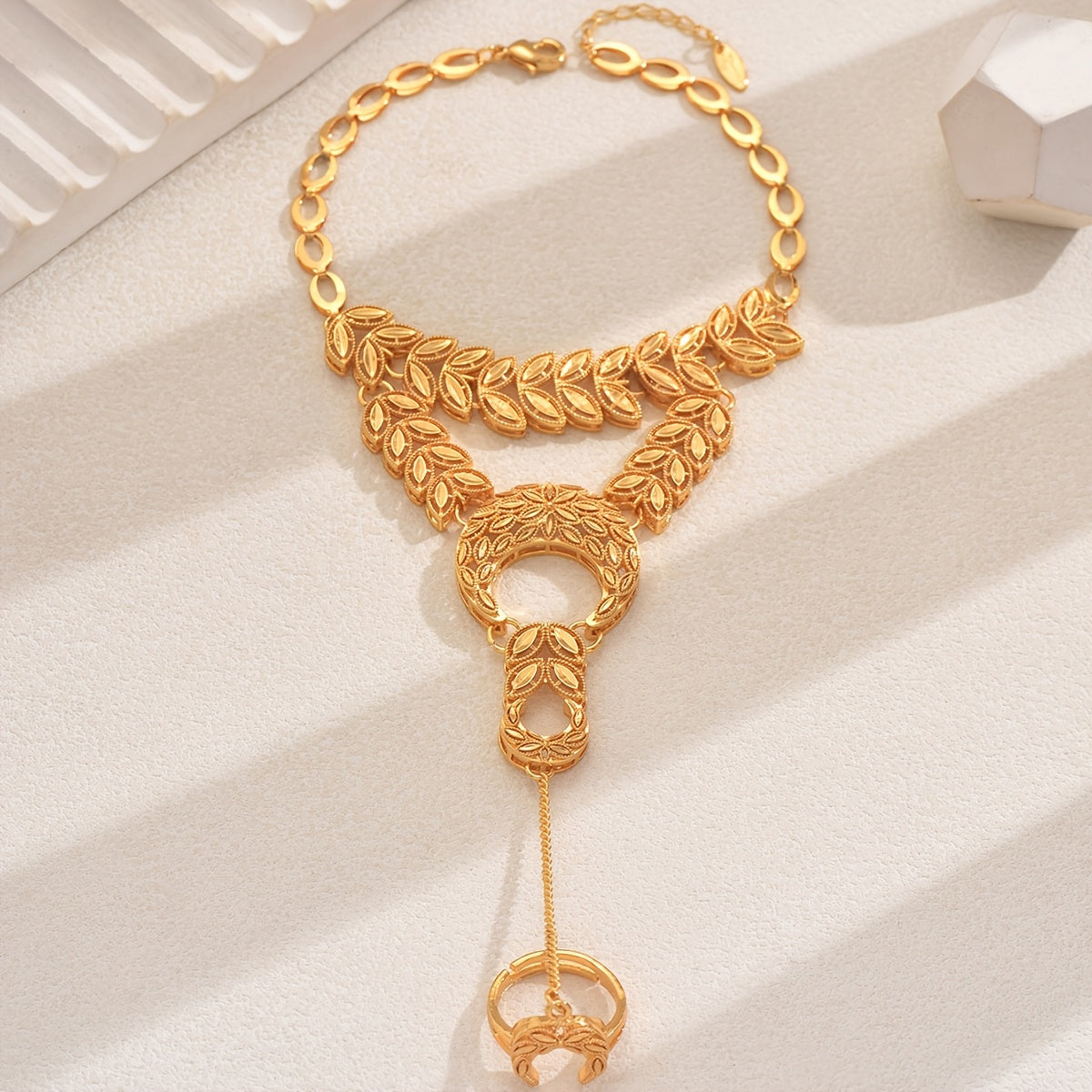 An elegant retro-style bracelet, perfect for women to wear at banquets, weddings, and engagements. This bracelet features a copper-plated gold-plated hollow wheat spike spliced moon design, giving it a unique and sophisticated look, making it ideal for