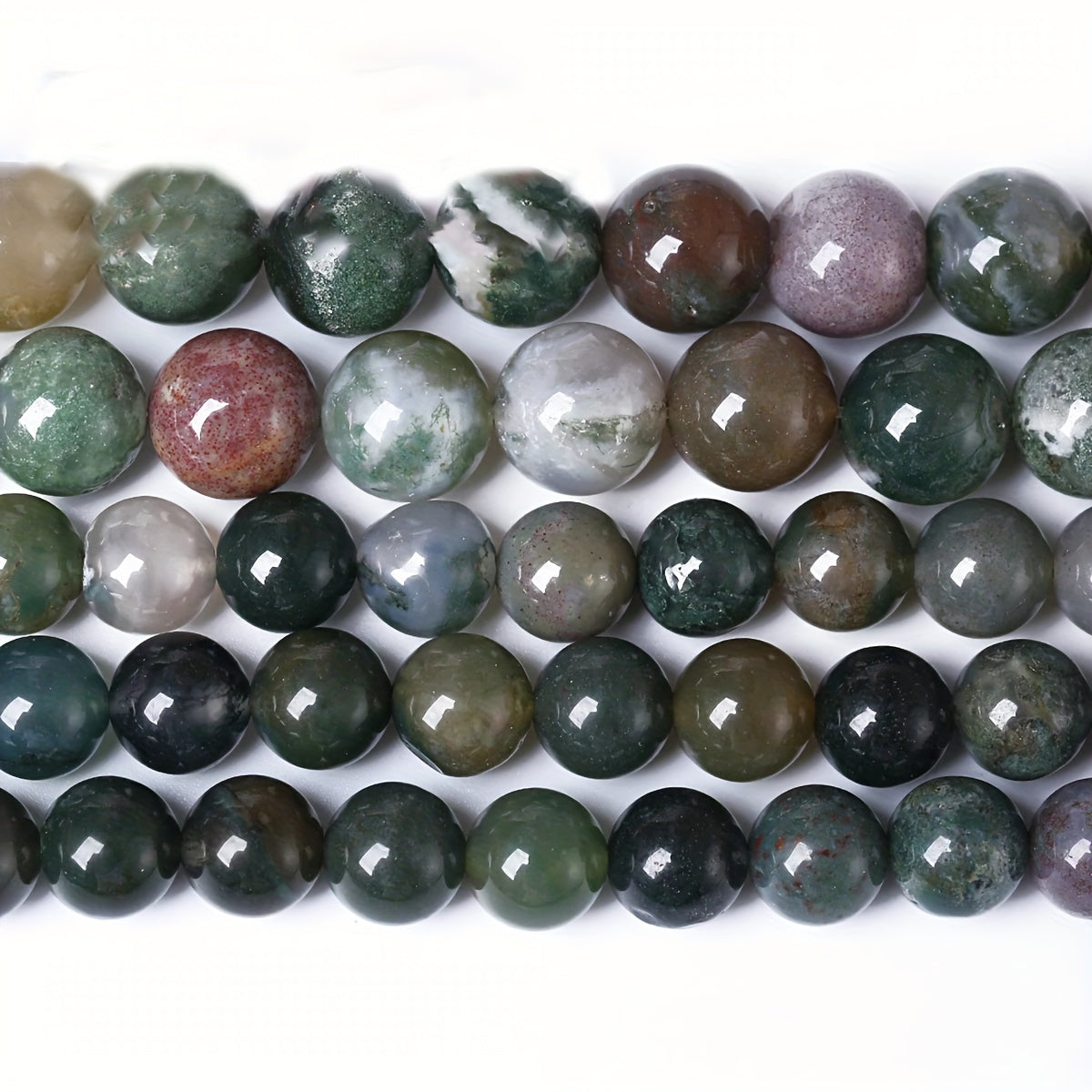 Indian Agate Round Loose Spacer Beads available in natural stone, perfect for DIY bracelet making. Each strand measures 15 inches in length with bead sizes of 4, 6, 8, 10, and 12mm. Ideal for creating unique jewelry accessories.