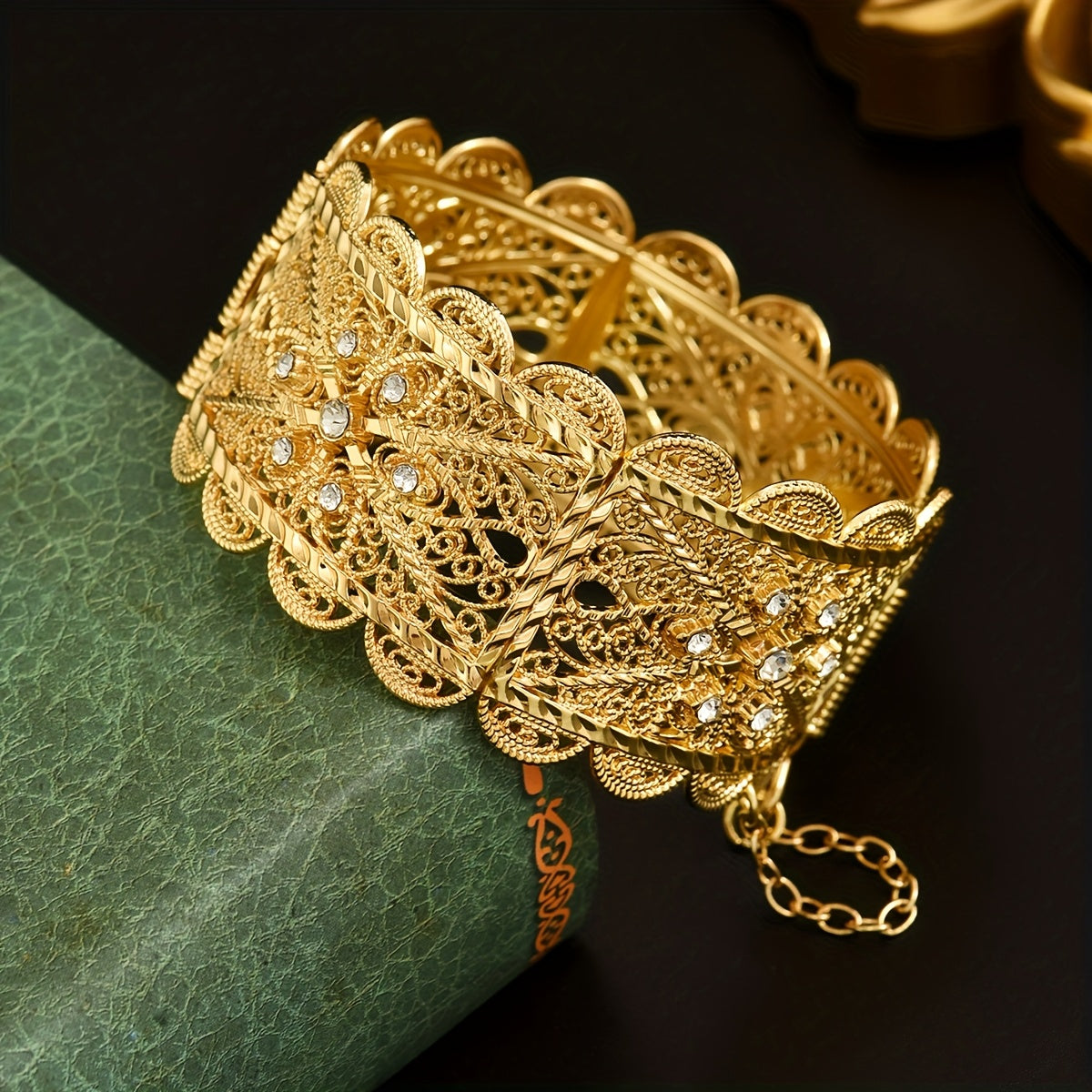 Luxurious 24K Gold Plated Zinc Alloy Bangle featuring Synthetic Stones in an Arabian Style Open Cuff design. This bracelet is adorned with a November birthstone and a beautiful floral theme, making it a perfect accessory for weddings, banquets, and