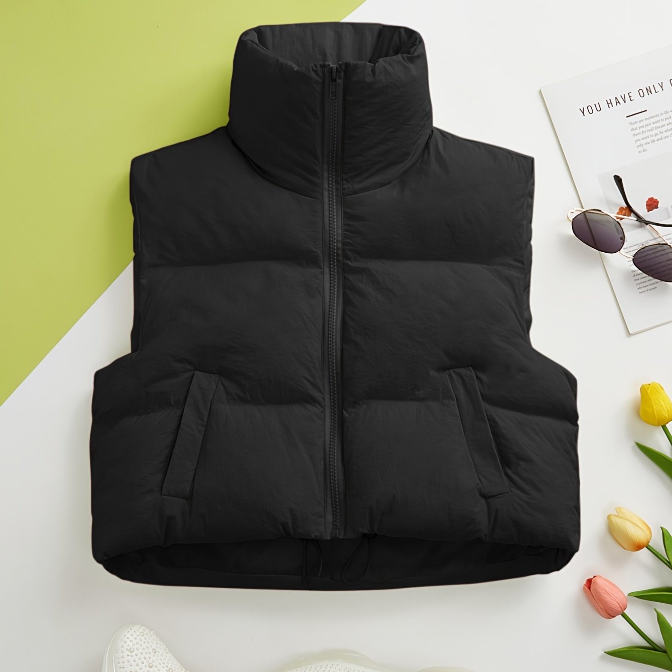 Women's solid zip-up puffy vest with casual sleeveless pockets, perfect for fall and winter.