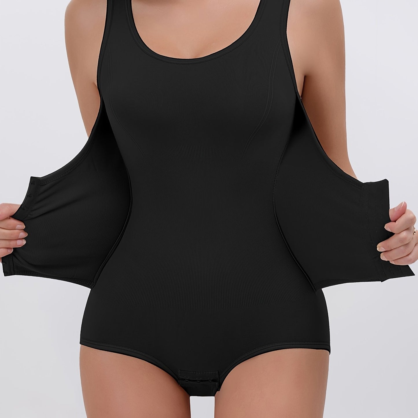 Slimming, cinching, and lifting bodysuit for women with hook closure, made from nylon-elastane blend.