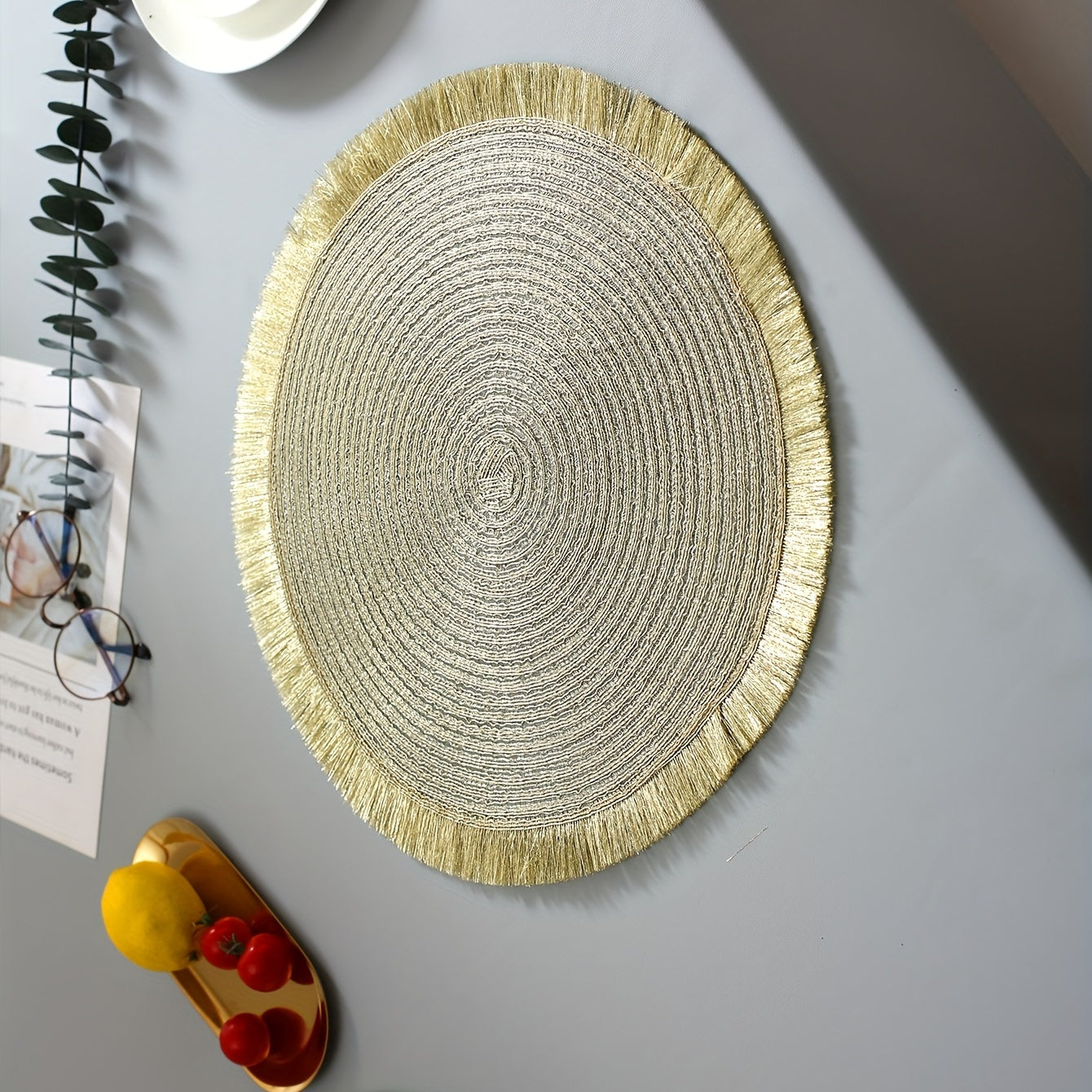 Insulated placemats with gold tassels, ideal for various occasions and easy to clean and use.