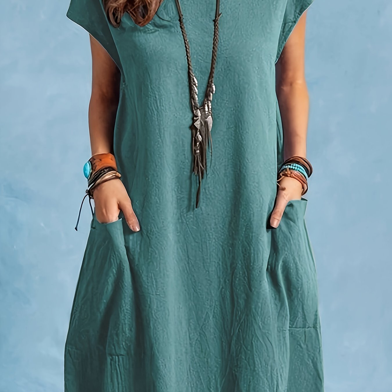 Women's spring/autumn dress with round neck, batwing sleeves, double pockets, and elegant solid color in cotton fabric.