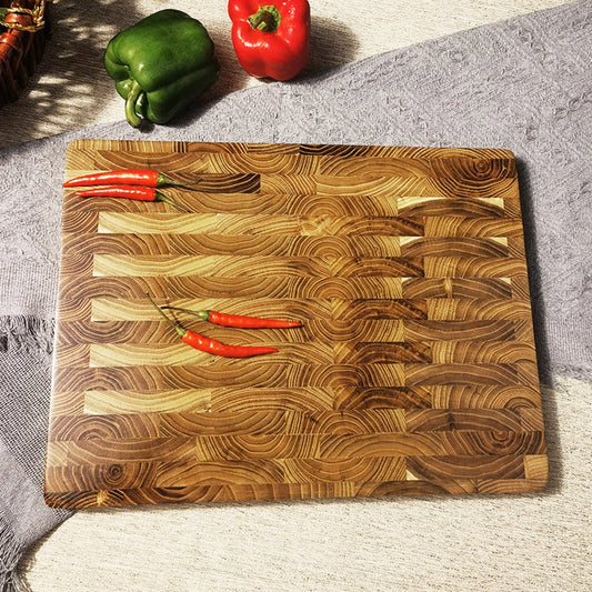 Teak cutting board for the kitchen, perfect for creative cooking at home. This thick wooden chopping board is ideal for all your cutting needs. Crafted from high-quality teak wood, this cutting board is a durable and stylish addition to your kitchen.