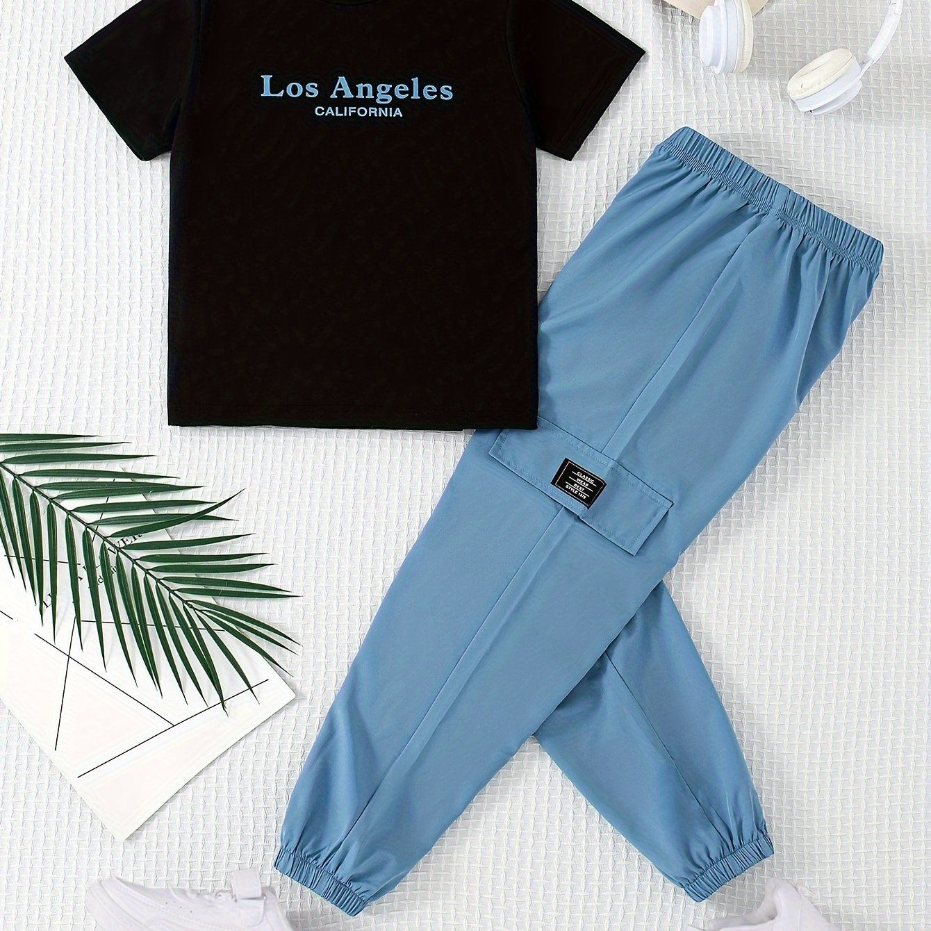 Teenage boys' summer outfit set with round neck printed top and trousers.