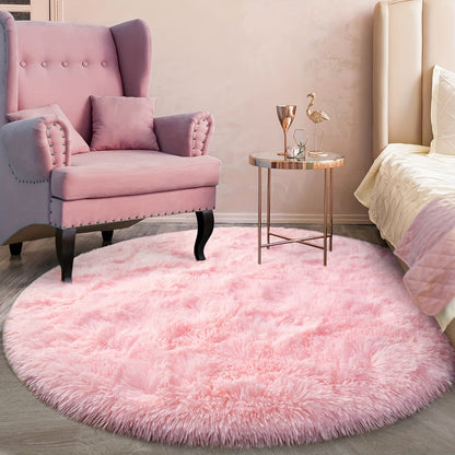 Upgrade your living room or bedroom decor with this super soft tie-dyed stylish pink round carpet rug. Made from upgraded shaggy and fluffy fabric, this larger floor rug adds a cozy atmosphere to any space. Durable and easy to maintain, this carpet is