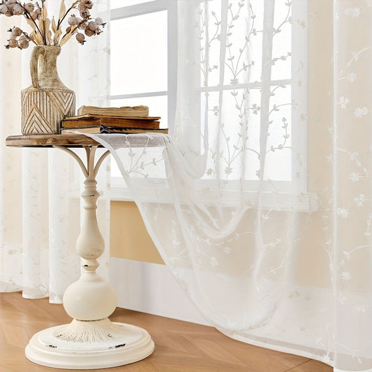 Pair of delicate, transparent gauze curtains adorned with small floral embroidery. These lightweight curtains are heat-insulating and breathable, making them perfect for use in living rooms, bedrooms, restaurants, hotels, or outdoor weddings. Ideal for