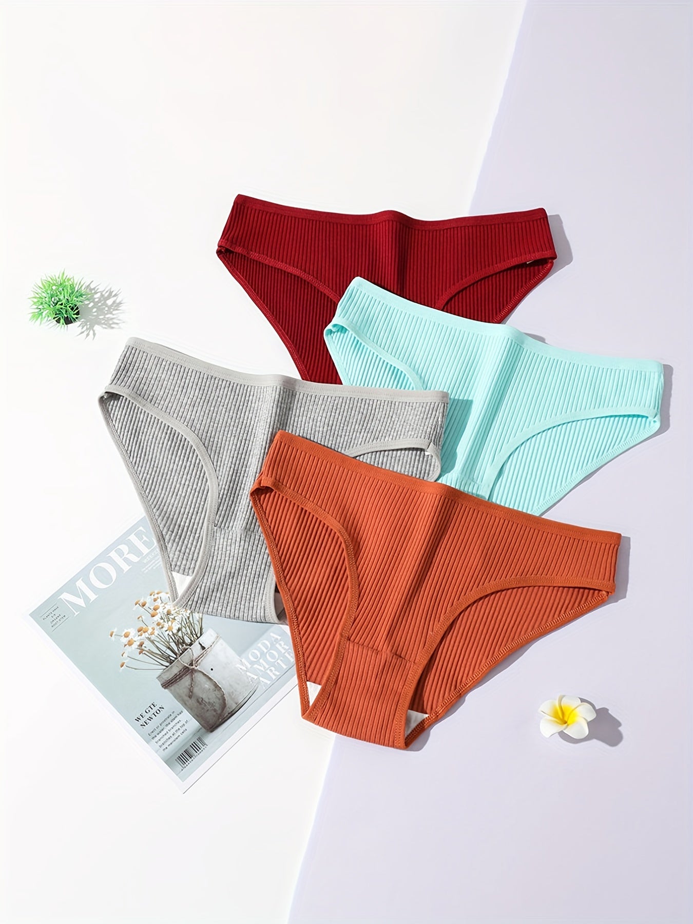 5 comfortable women's briefs with butt lift, low-rise, breathable, double-layered, available in red, gray, teal, orange, and black solid colors. Made of soft ribbed stretch material.