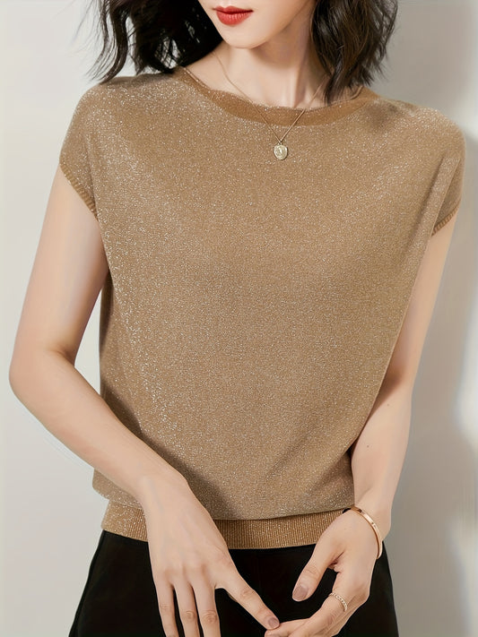 Refreshingly loose and comfortable knitted piece with metallic threads, boasting a minimalist style.