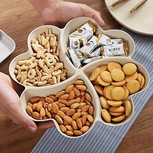 Heart-shaped party snack tray with 4 compartments, perfect for serving nuts, candy, fruit, and other snacks. Made of reusable plastic in blue, green, beige, and pink colors.