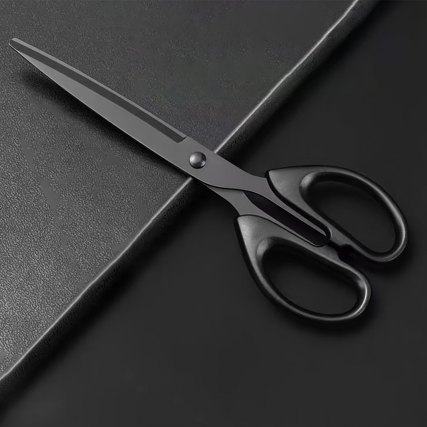 Thickened black edge scissors with non-stick coating for daily home, office, and art paper cutting.