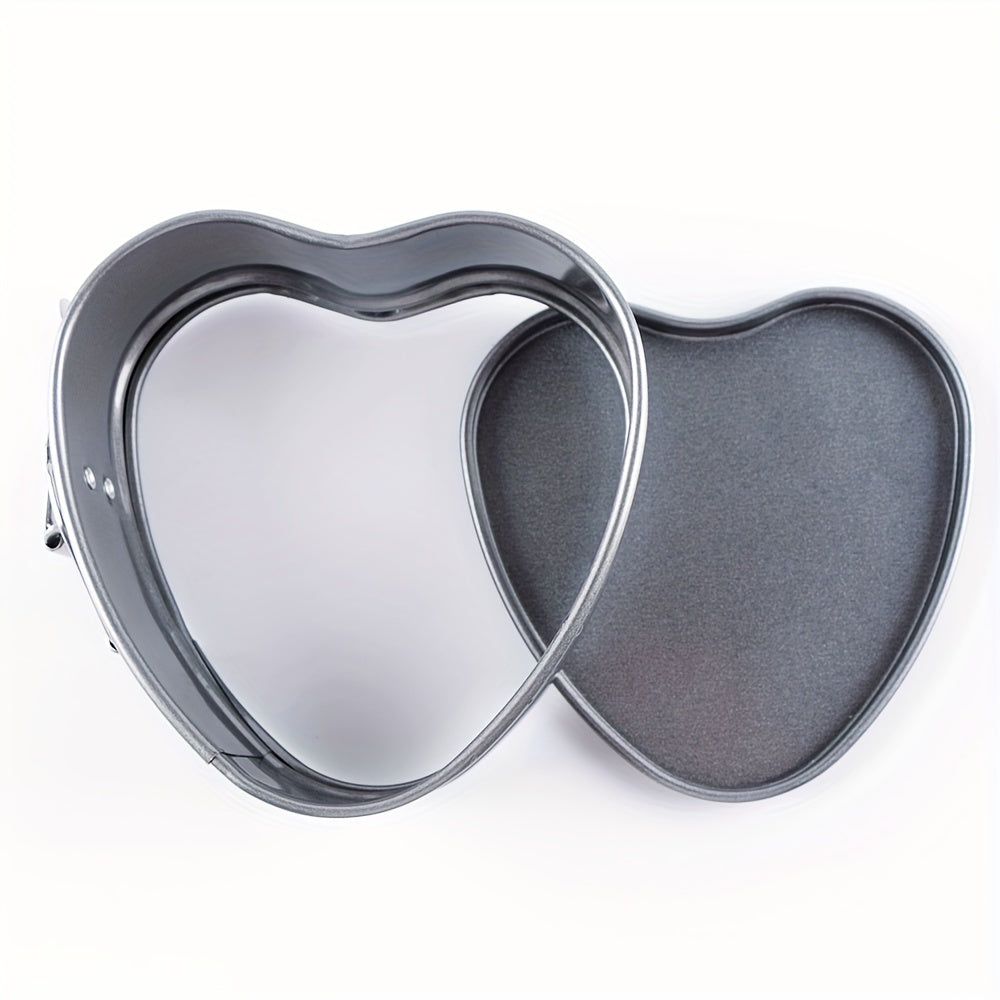 Heart-shaped detachable bottom baking pan, measuring 10.49cm, perfect for making cheesecakes, fried eggs, pudding molds, cake tiers, wedding cakes, and more. This nonstick springform pan features a removable bottom for easy release and is leakproof. It