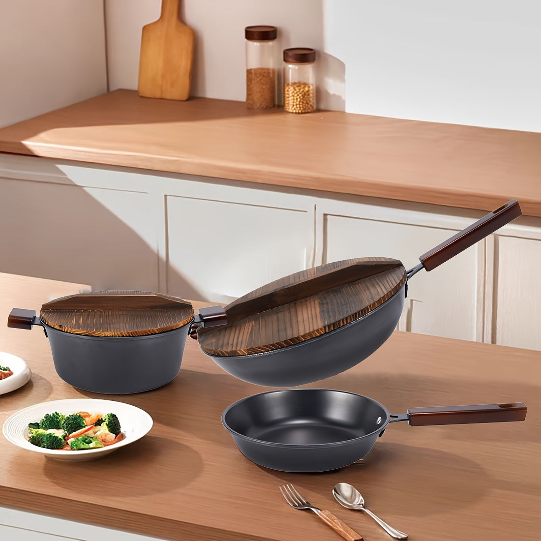 Vintage Kitchen Three-piece Set includes a 32cm Wok, 24cm Soup Pot, and 24cm Frying Pan. Set comes with 2 Charcoal Burning Wooden Covers, made from Original Cast Iron with Charcoal Burning Wooden Handles. Features Non-stick Layer Technology and an