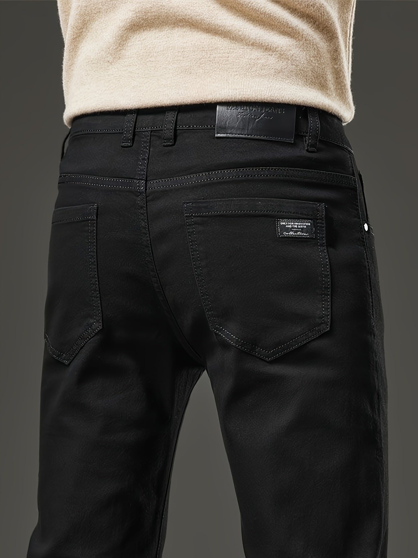 Slim fit men's jeans made of stretch denim in a solid color with washed details, suitable for year-round wear.