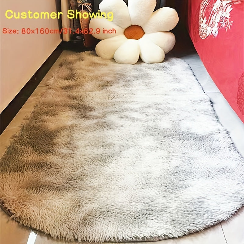 Soft and fluffy oval area rug, designed for use in living rooms, bedrooms, game rooms, and dormitories. Made of non-slip, washable polyester material. Machine-made shaggy rug perfect for adding a cozy touch to your space. Ideal for use as a bedside