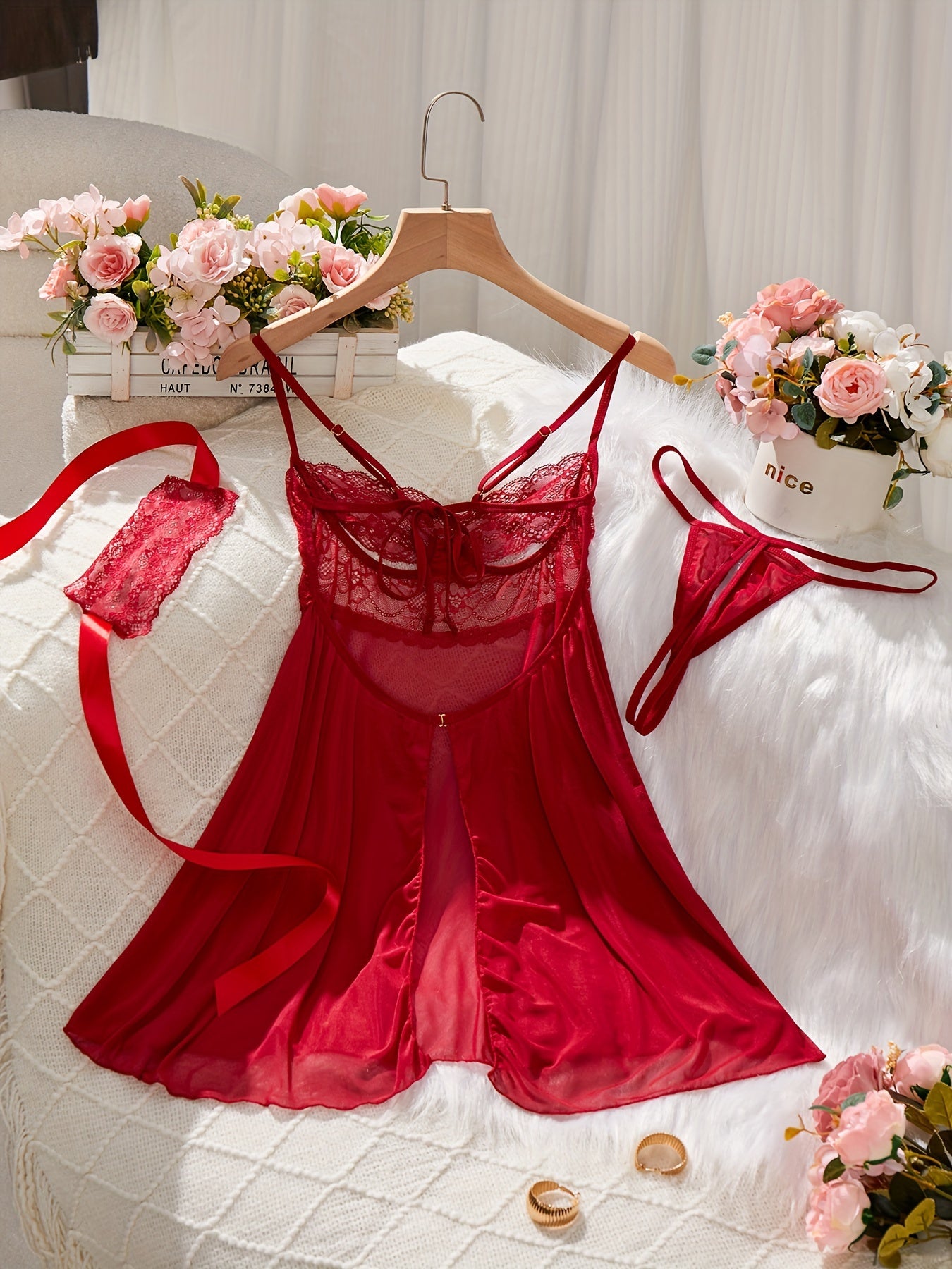 Red lingerie set featuring babydoll dress, G-string panty, eye mask, lace detail, satin ribbon accents - perfect for seductive boudoir attire.