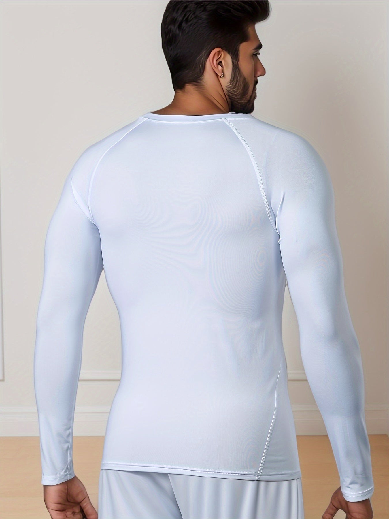 Men's Thermal Underwear Set for skiing in winter, with long sleeve top and bottom pants.