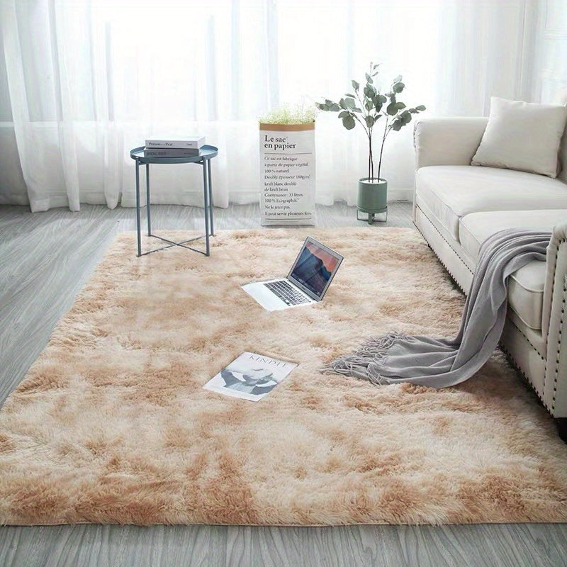 Soft plush area rug, perfect for any room in your home! This non-slip fuzzy shag rug is ideal for adding a touch of luxury to your bedroom or living room. The tie-dyed design adds a unique and stylish touch to your decor. Made with pet-friendly