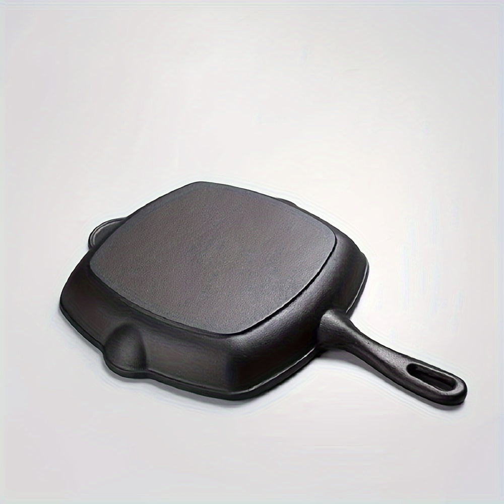 This new large steak frying pan is made of thickened cast iron, making it perfect for use in a new home. It can also be used for frying fish and features a special design that makes it compatible with both gas and electric stoves. The pan has a flat