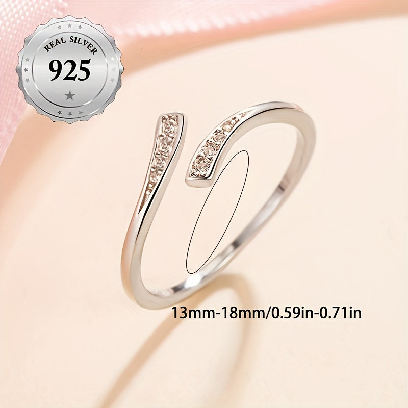 A stylish women's open ring featuring an infinity symbol and an endless loop design adorned with sparkling synthetic cubic zirconia for added bling. This minimalist and classic piece is made from lightweight 1.5g 925 sterling silver, making it suitable