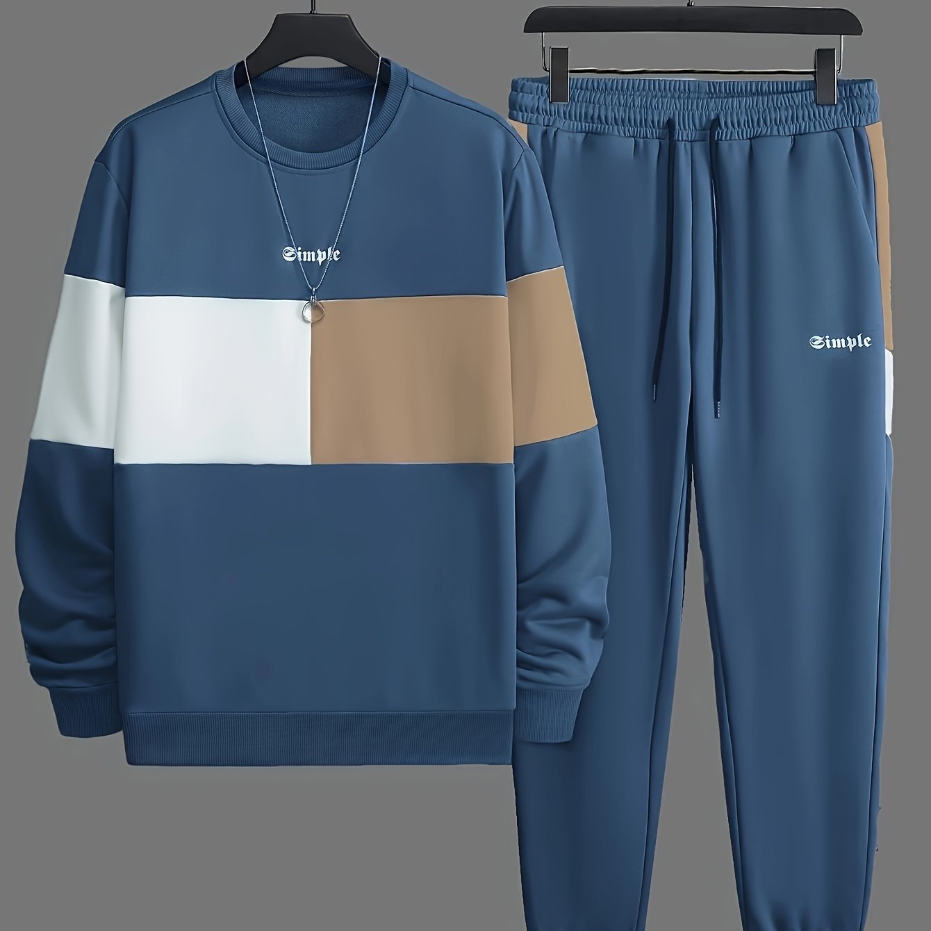 Men's casual crew neck sweatshirt and joggers set. Color block design in polyester blend, machine washable. Ideal for spring and fall, leisure style.