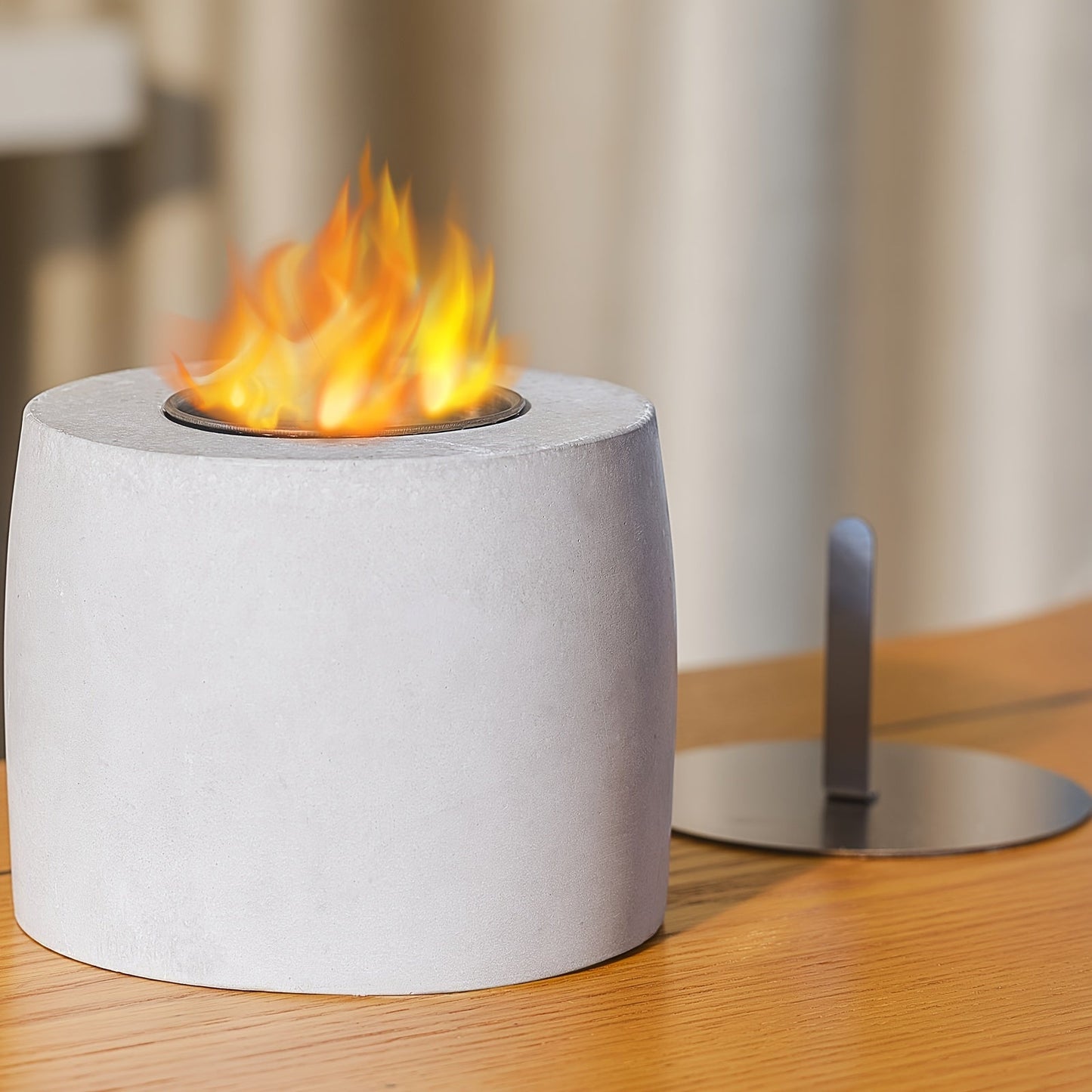 Compact and sleek, the Modern Tabletop Concrete Fire Pit is a versatile stainless steel ethanol fireplace suitable for both indoor and outdoor use. Equipped with a safety liner and fire extinguisher, this stylish fire pit requires no electricity, making