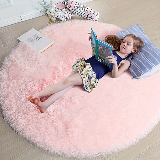 Soft shaggy round rug made of 100% grey polyester. This fluffy area rug is machine washable, fade resistant, and features a low pile tufted weave with PVC backing. Perfect for bedroom, nursery, and kids room decor. Great for gifts on Christmas