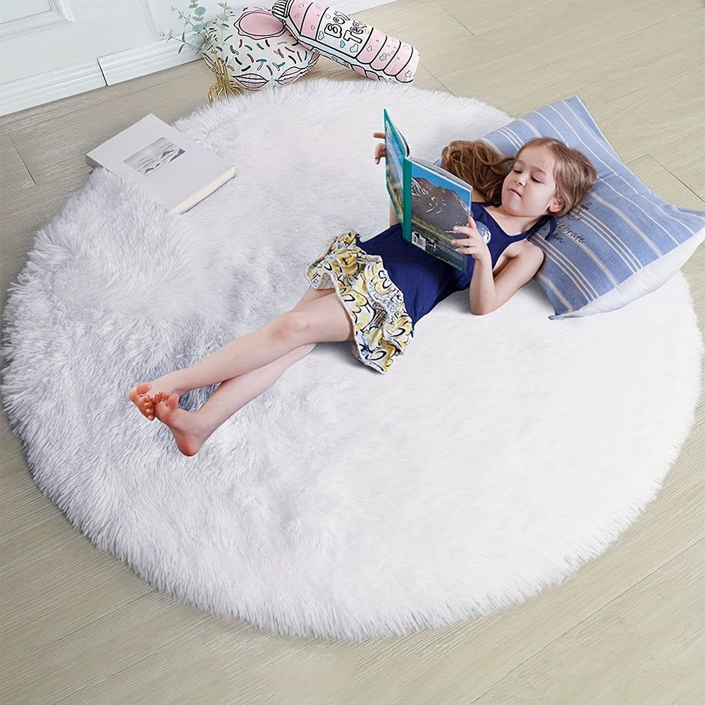 Soft shaggy round rug made of 100% grey polyester. This fluffy area rug is machine washable, fade resistant, and features a low pile tufted weave with PVC backing. Perfect for bedroom, nursery, and kids room decor. Great for gifts on Christmas