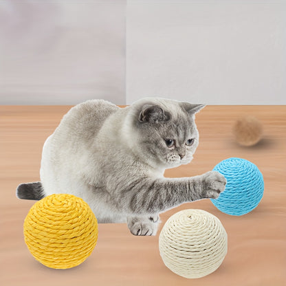 Interactive sound-making cat scratching ball toy made of cardboard material for cats to relieve play with their pet companion.