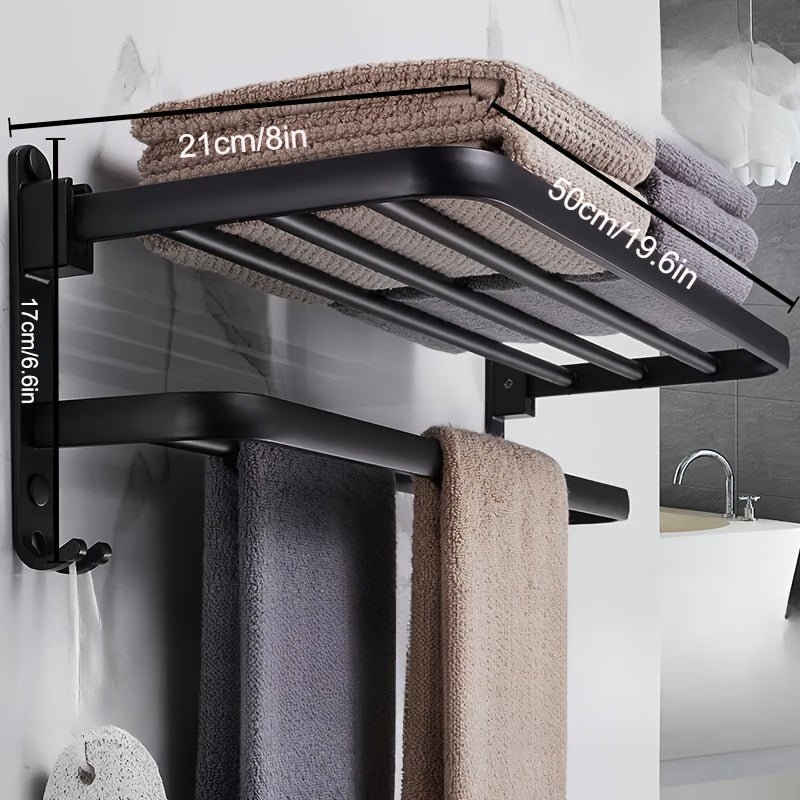 Compact black wall-mounted bathroom shelf with towel bar and hooks for convenient storage of towels, toiletries, and accessories. Easy to install with a sleek modern design and sturdy metal construction. Perfect towel holder for any bathroom.