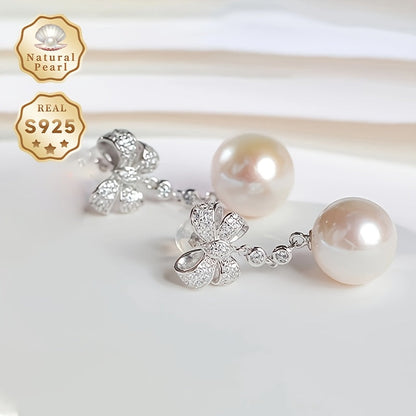 These women's fashionable dangling earrings feature a pair of 12-13mm large grains of strong light, slightly flawed round natural freshwater pearls set in S925 silver. Each earring is adorned with a delicate bow and comes in a gift box. Please note that