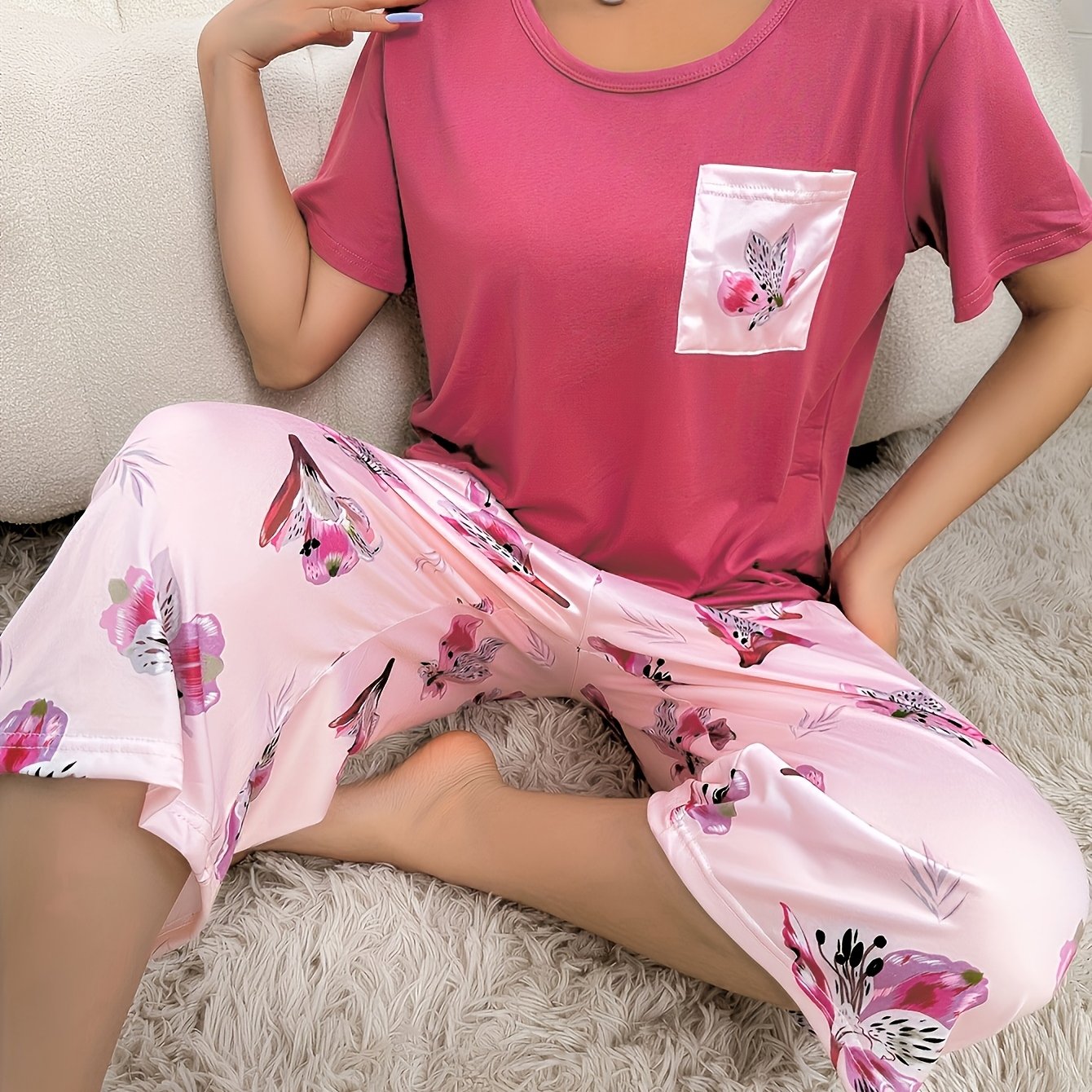 Floral print pajama set for women with short sleeve top and capri pants, in a comfortable relaxed fit.