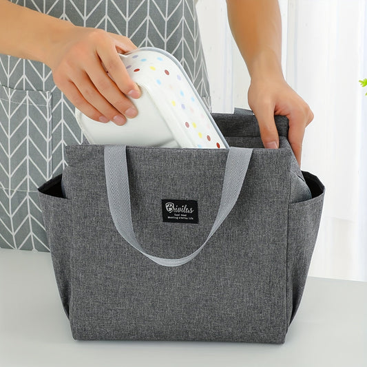 Travel in style with the Oxford Fabric Lunch Bag, a durable and insulated food container that has been thickened and expanded for extra space. This portable rectangular bento box features convenient side pockets for storing utensils or napkins. The sleek