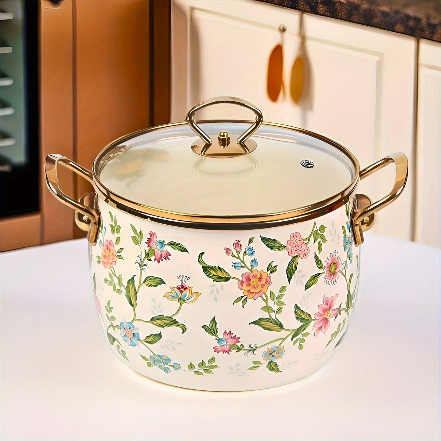 Large capacity enamel saucepan with glass lid and floral design is a non-stick, dishwasher-safe kitchen cookware with double handles. This soup pot features a golden handle for added style and convenience.