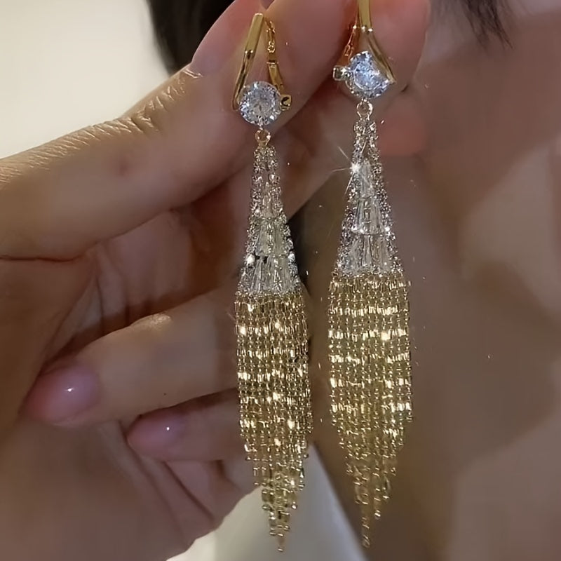 Elegant tassel earrings with sparkling zirconia, perfect for everyday wear or special occasions. Add a touch of glamour to your casual outfits or date night look.