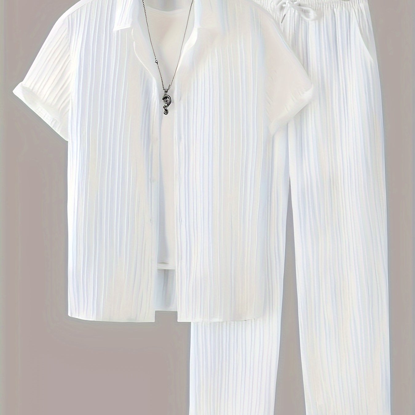 Stylish men's set: striped shirt with buttons and drawstring pants for casual outdoor wear.