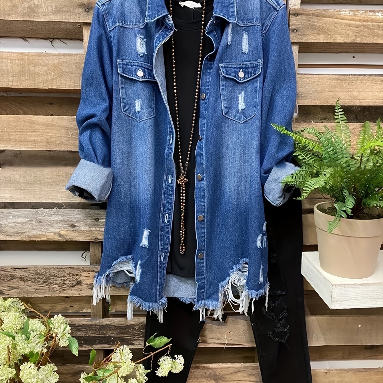 Women's oversized denim jacket with asymmetrical hem, lapel collar, and raw hem detail. Made from non-stretch 100% fabric, suitable for all seasons.