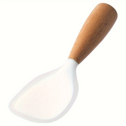 Heat resistant silicone spoon with wooden handle for non-slip rice cooker. Practical kitchen tool for home, school, and dorm.