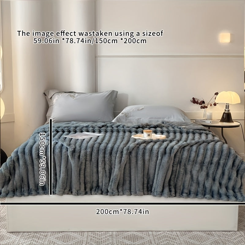 Stay warm and cozy with the FAGEJIE Luxury Faux Rabbit Fur Throw Blanket. Ideal for snuggling up on the sofa, bed, or while traveling. This all-season comfy gift is perfect for Christmas and is made of a soft polyester blend. Hand wash only and suitable