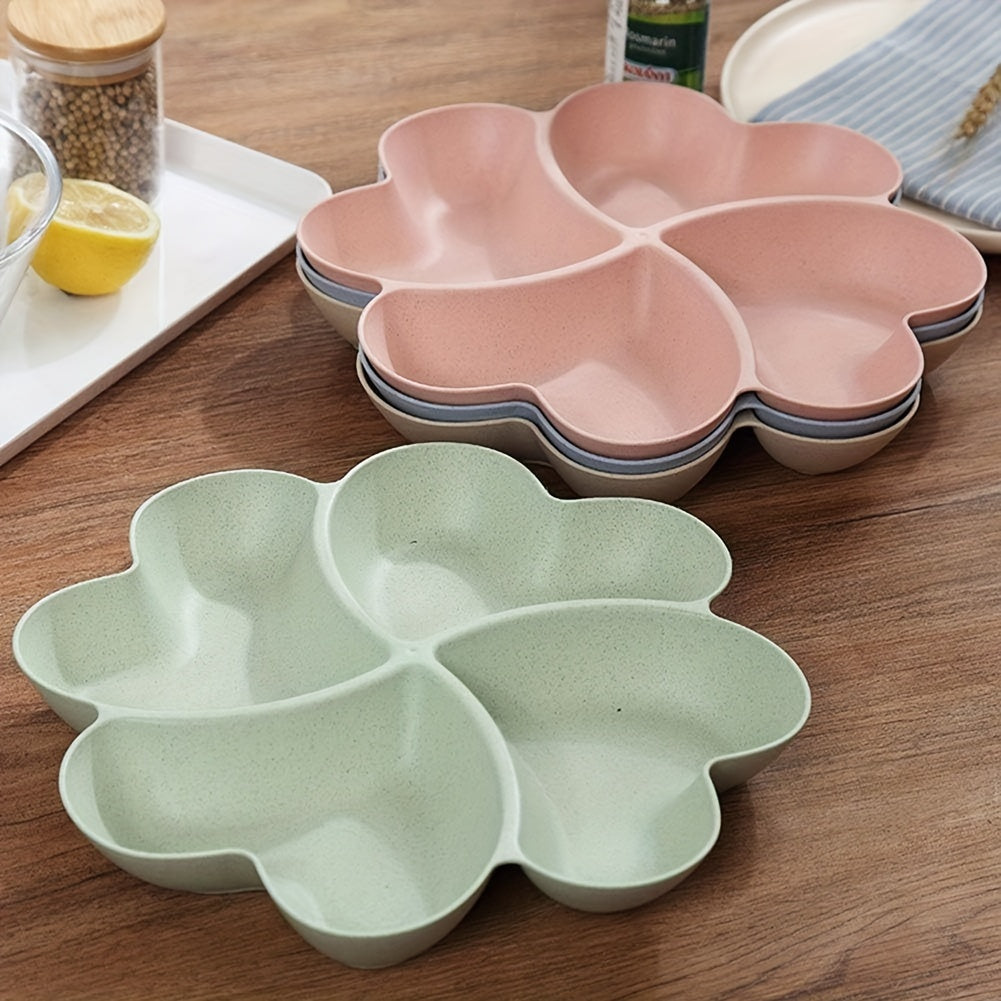 4 durable heart-shaped party snack serving trays in blue, green, beige, and pink. Perfect for organizing snacks at parties and gatherings. Made of lightweight plastic.