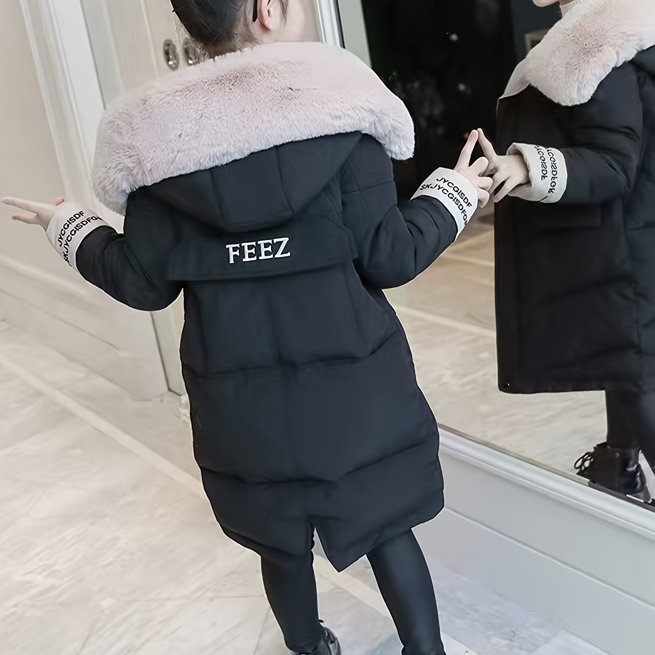 Girls' winter puffer coat with faux fur hood, embroidered alphabet detail, and casual skinny fit. Made of woven polyester, this thick warm jacket is perfect for cold weather.