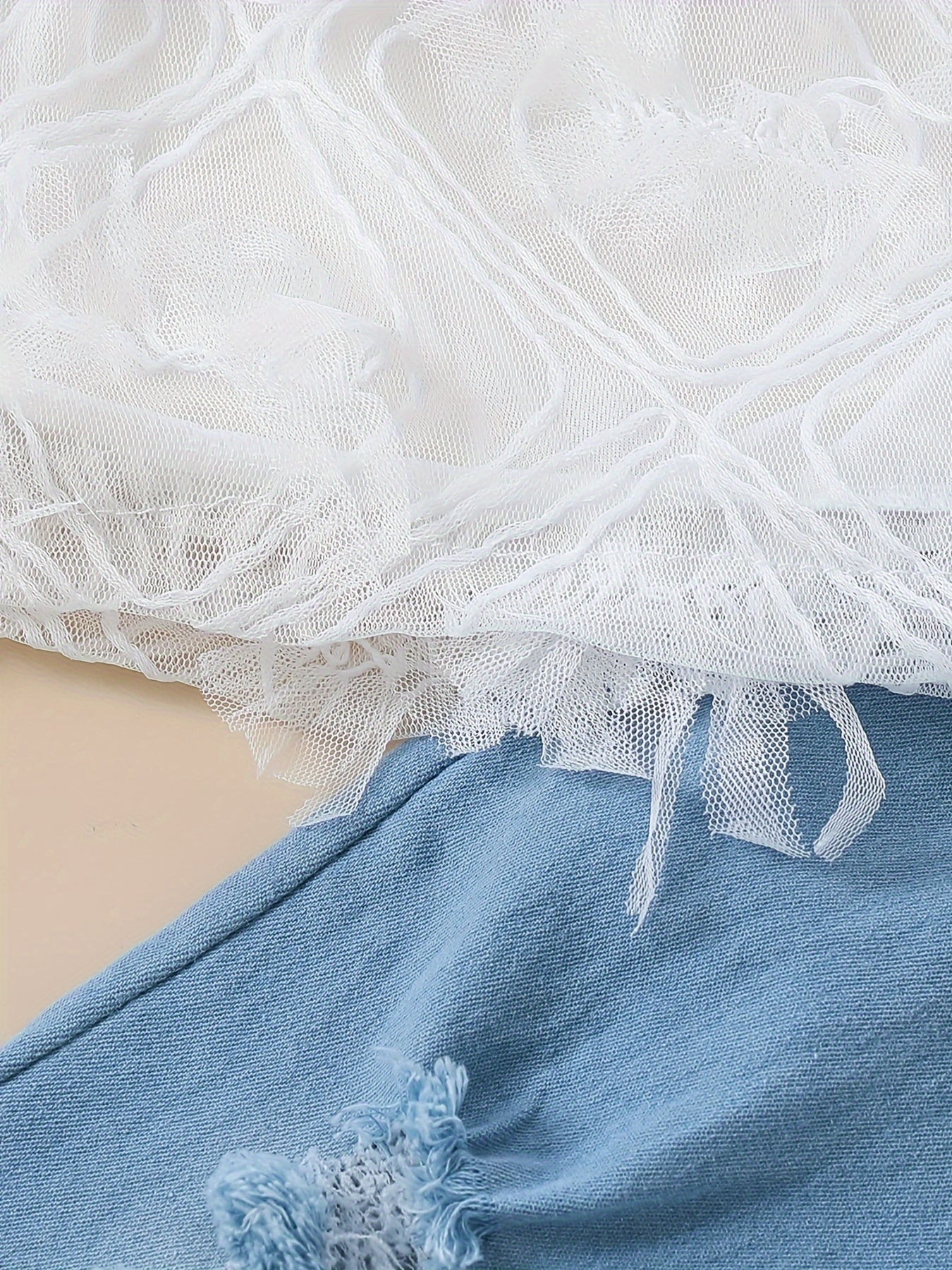 Stylish girls' summer outfit: off-shoulder white lace top with blue tulle flared pants set. Made of 100% polyester, machine washable. Perfect for outdoor wear.